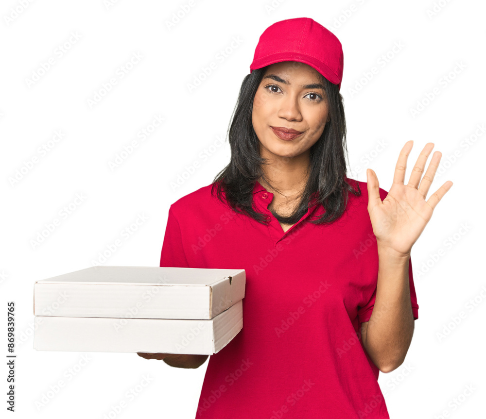 Latina delivering pizza, studio setup smiling cheerful showing number five with fingers. Latina delivering pizza, studio setup smiling cheerful showing number five with fingers.