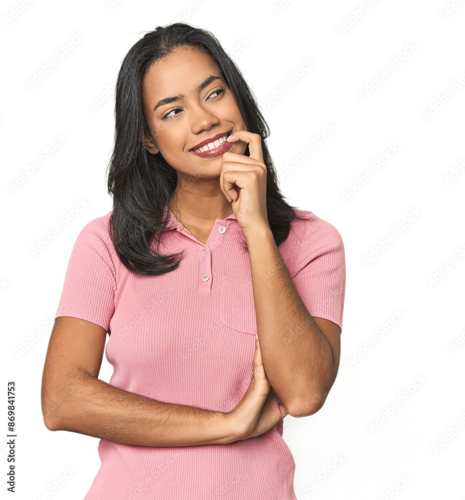 Simple portrait of a young Latina relaxed thinking about something looking at a copy space. Simple portrait of a young Latina relaxed thinking about something looking at a copy space.