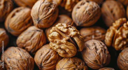 Close Up View of Shelled Walnuts on a Wooden Surface photo