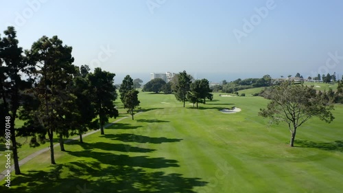 Country Club golf course with blue sky overlooking the Pacific Ocean and city of La Jolla in California during a sunny day photo