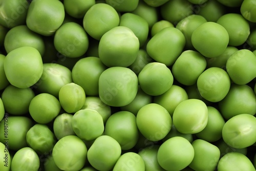 Fresh green peas as background, above view