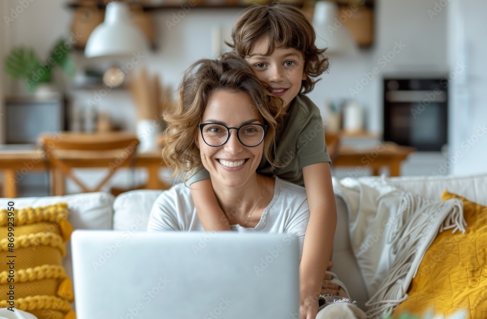 Happy mother and child at home bonding and working on laptop Happy mother and child at home bonding and working on laptop
