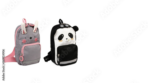 Closeup of colorful panda and bunny-shaped schoolbags isolated on white background.