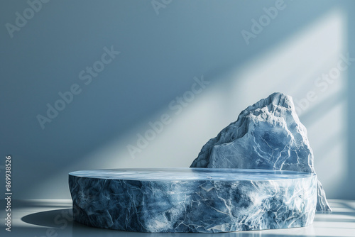 A sophisticated mockup scene featuring a blue marble pedestal and a natural rock under soft natural lighting, ideal for product display and presentations