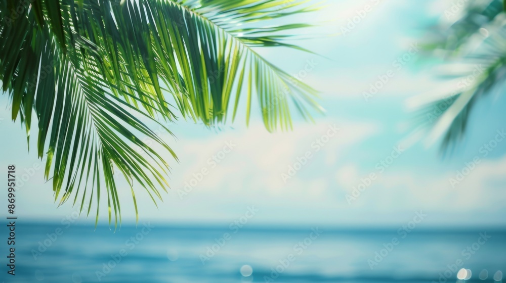 The image captures a relaxing view of palm leaves dangling over a tranquil ocean, with a clear blue sky providing the perfect backdrop for a peaceful tropical escape. The image captures a relaxing view of palm leaves dangling over a tranquil ocean, with a clear blue sky providing the perfect backdrop for a peaceful tropical escape.