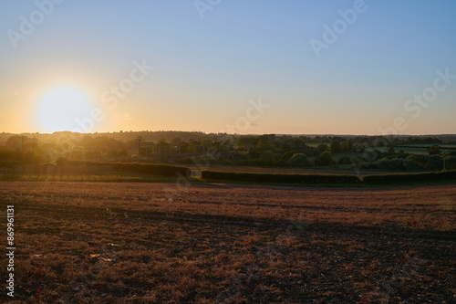 Valokuva Sunset over a ploughed field in england