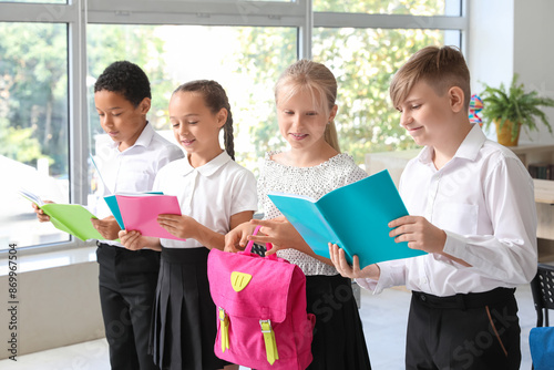 Little classmates with note...