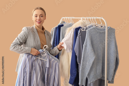 Happy female stylist with c...