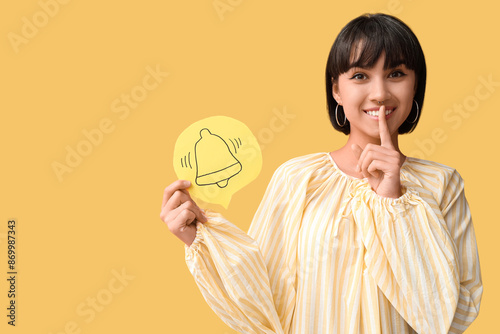 Pretty young woman holding ...