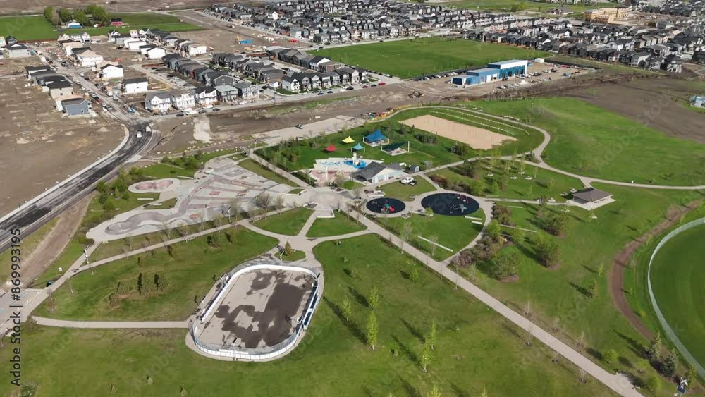 Aerial new home construction on city outskirts looking down on outdoor park space in Airdrie Alberta Canada.
Aerial new home construction on city outskirts looking down on outdoor park space in Airdrie Alberta Canada.