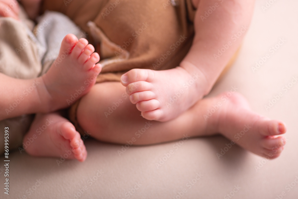 Little newborn baby human feet with toes and toenails close up Little newborn baby human feet with toes and toenails close up
