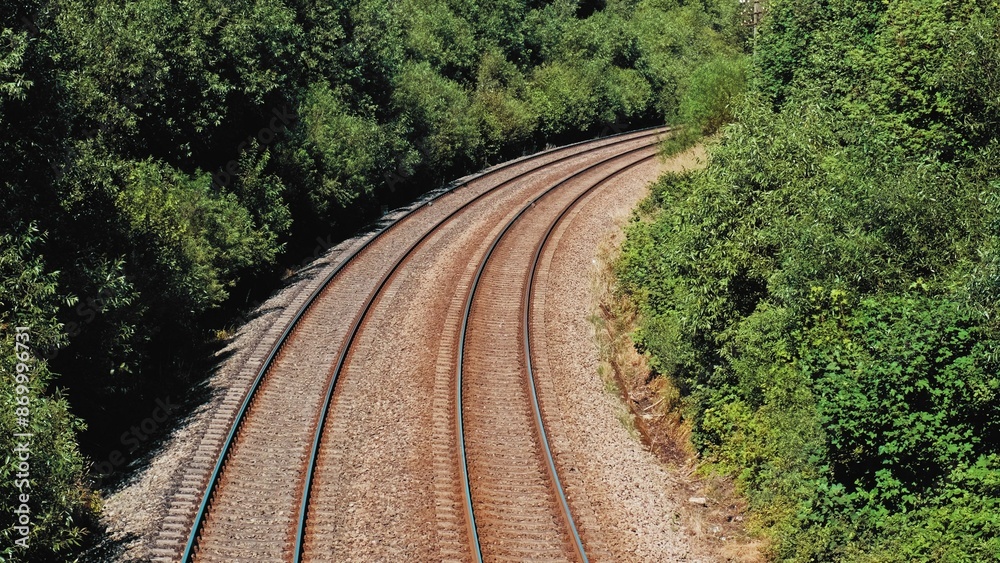 Parallel Railroad Tracks with Concrete Underlay and Crushed Stones Ballast Trackbed Parallel Railroad Tracks with Concrete Underlay and Crushed Stones Ballast Trackbed