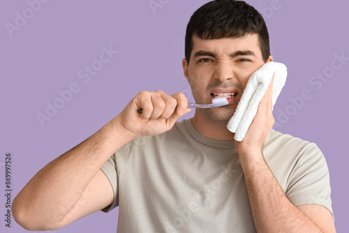 Young man with brush and to...
