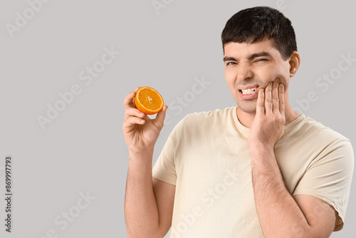 Young man with orange suffe...