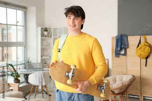 Male student with skateboar...