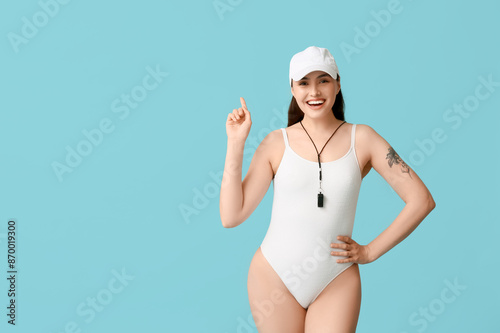 Female lifeguard with whist...