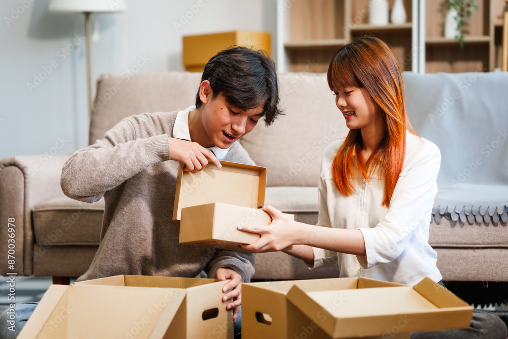 Young women, men, and Asian people prepare for moving into a new home. From unpacking supplies to updating documents, follow a comprehensive checklist in the living room with a big cardboard box. Young women, men, and Asian people prepare for moving into a new home. From unpacking supplies to updating documents, follow a comprehensive checklist in the living room with a big cardboard box.