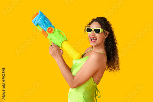 Excited young woman in gree...