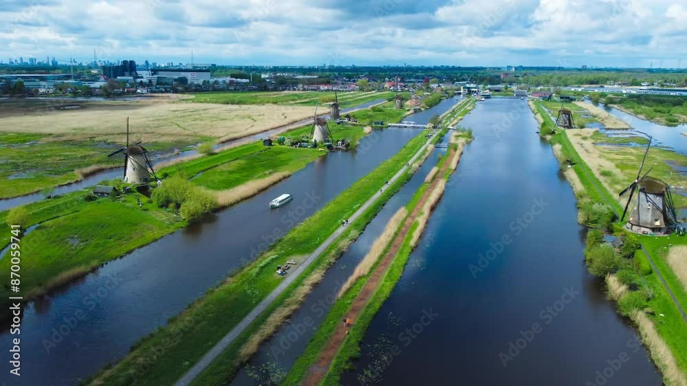 Aerial View of Windmills on Water Canal in Village Kinderdijk, The Netherlands Aerial View of Windmills on Water Canal in Village Kinderdijk, The Netherlands