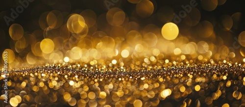 Abstract gold glitter bokeh with black background