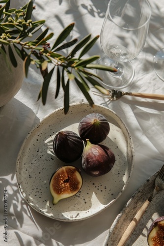 Fresh Figs and Grapes on a Spotted Plate in Natural Sunlight