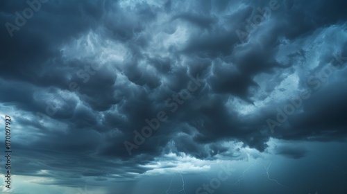 A sky filled with dark, ominous storm clouds, rumbling with distant thunder, evokes both fear and awe of nature's power.