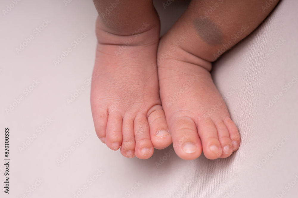 Little newborn baby human feet with toes and toenails close up Little newborn baby human feet with toes and toenails close up