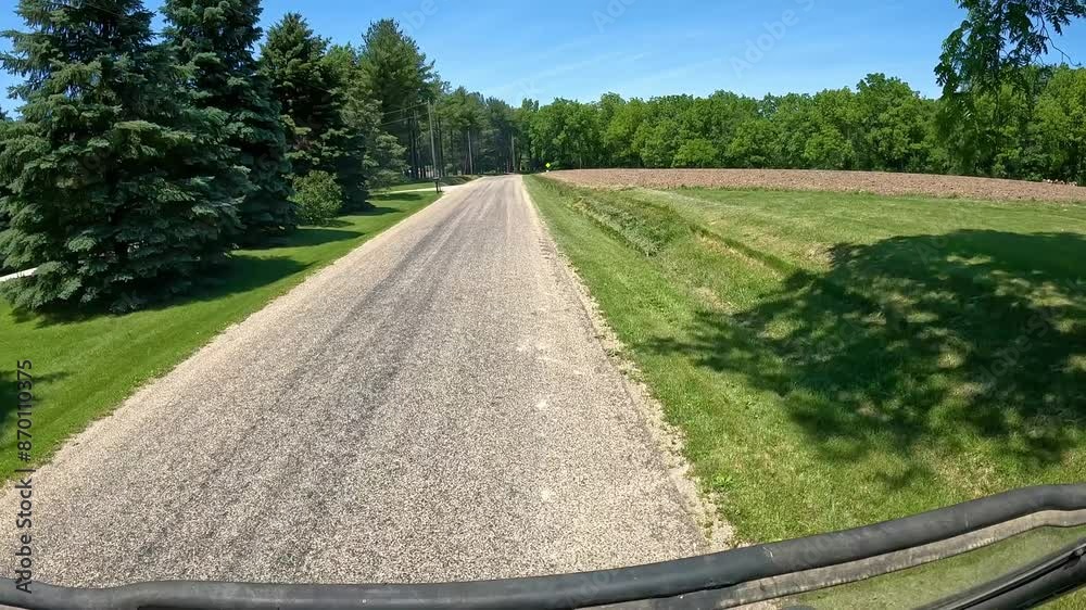 POV - driving past newly planted fields, farm yards, timbers and country homes; a rural county road in western Illinois on a bright spring day POV - driving past newly planted fields, farm yards, timbers and country homes; a rural county road in western Illinois on a bright spring day