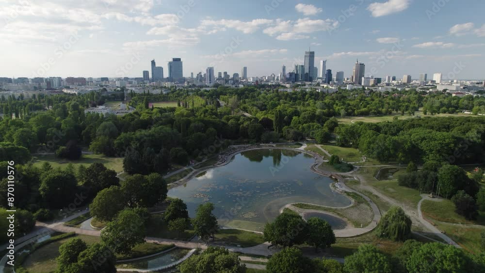Skyline of Warsaw on beautiful green park with water pond, aerial view Skyline of Warsaw on beautiful green park with water pond, aerial view
