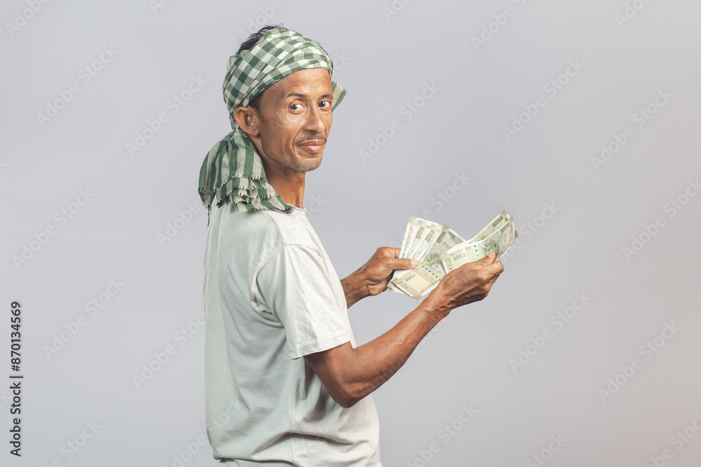 farm labourer counting indian rupees paper currency farm labourer counting indian rupees paper currency