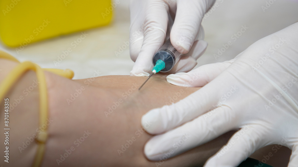 Blood collecting from a vein for test. Laboratory with nurse taking a blood. Blood chemistry. Blood collecting from a vein for test. Laboratory with nurse taking a blood. Blood chemistry.