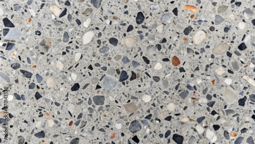 Abstract grey marble stone terazzo texture with flecks of dark and light tones blending in a mesmerizing pattern.
