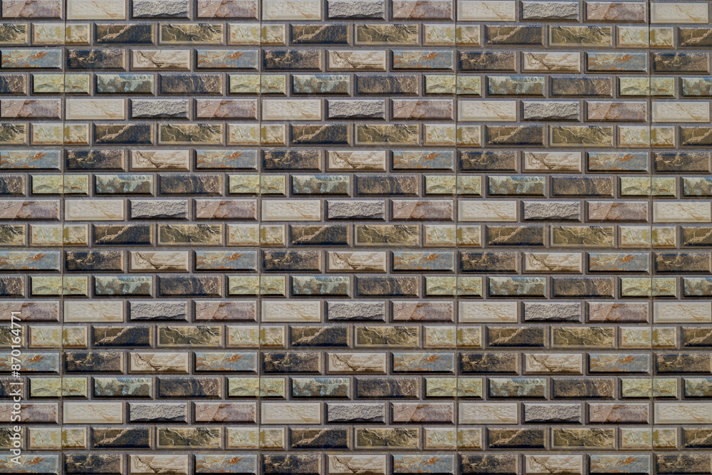 Tiled wall of ceramic with pattern motif in mixed color Tiled wall of ceramic with pattern motif in mixed color