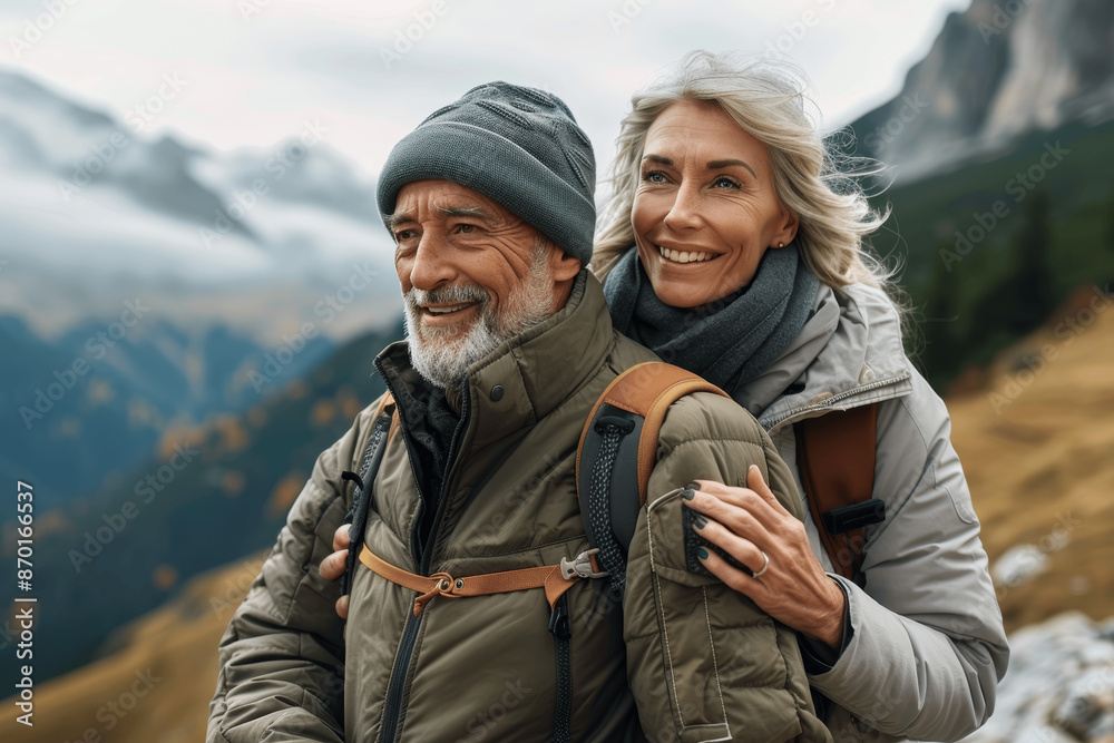 Happy senior couple smiling and hiking in nature on the mountains, enjoying active retirement and outdoor activities, exploring scenic coastal trails and embracing healthy lifestyle together Happy senior couple smiling and hiking in nature on the mountains, enjoying active retirement and outdoor activities, exploring scenic coastal trails and embracing healthy lifestyle together