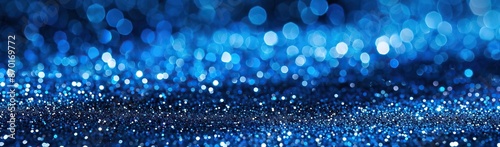 Blue glitter texture with sparkling highlights ideal for festive backgrounds holiday celebrations and joyful atmosphere