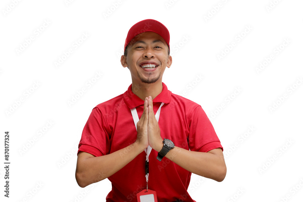 Asian delivery man or courier is shown with hands together in a traditional Eid Mubarak greeting, isolated on a white background, Concepts of greetings and the festive spirit in delivery services Asian delivery man or courier is shown with hands together in a traditional Eid Mubarak greeting, isolated on a white background, Concepts of greetings and the festive spirit in delivery services