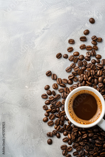 Coffee cup surrounded by coffee beans, warm beverage with copy space photo