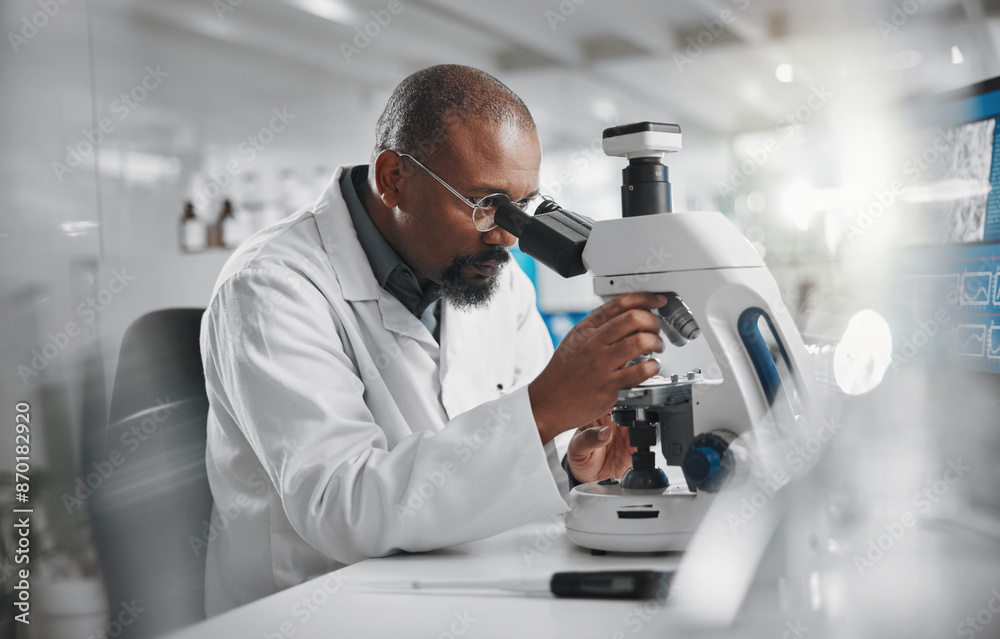 Scientist, development and microscope in laboratory for analysis, innovation and medical research. Black man, technology and professional person or expert in clinic for diagnosis, cure or health care Scientist, development and microscope in laboratory for analysis, innovation and medical research. Black man, technology and professional person or expert in clinic for diagnosis, cure or health care