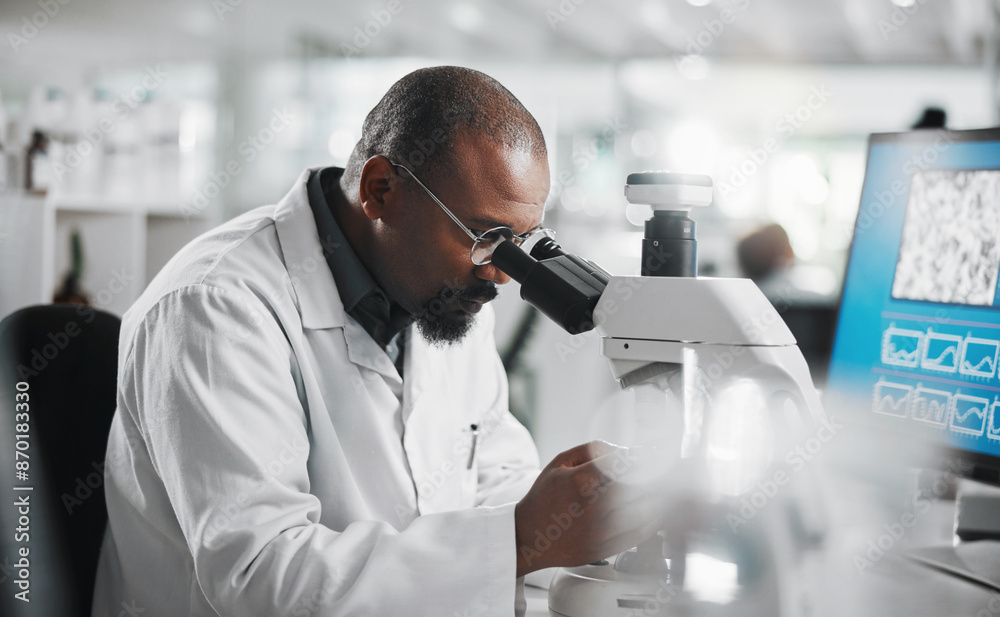 Black man, computer and microscope in laboratory for analysis, innovation and medical research. Development, scientist and professional person or expert in clinic for diagnosis, cure or health care Black man, computer and microscope in laboratory for analysis, innovation and medical research. Development, scientist and professional person or expert in clinic for diagnosis, cure or health care