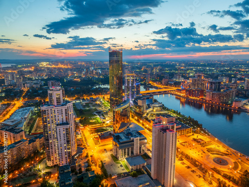 Yekaterinburg city and pond aerial panoramic view at summer or early autumn night. Night city in the early autumn or summer.