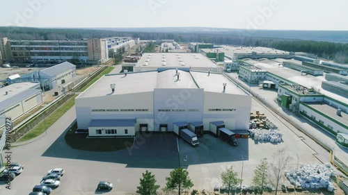 Aerial view of a modern industrial warehouse with infrastructure for storage and transportation