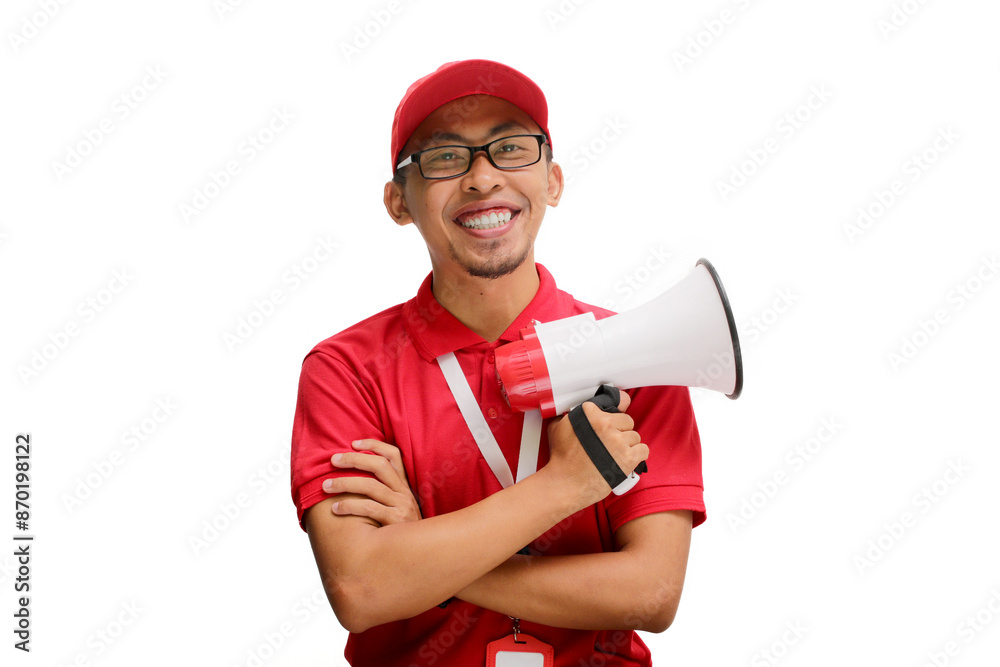 Confident Asian delivery man or courier in a red delivery uniform, wearing a red cap and polo shirt, holding a megaphone, isolated on a white background Confident Asian delivery man or courier in a red delivery uniform, wearing a red cap and polo shirt, holding a megaphone, isolated on a white background