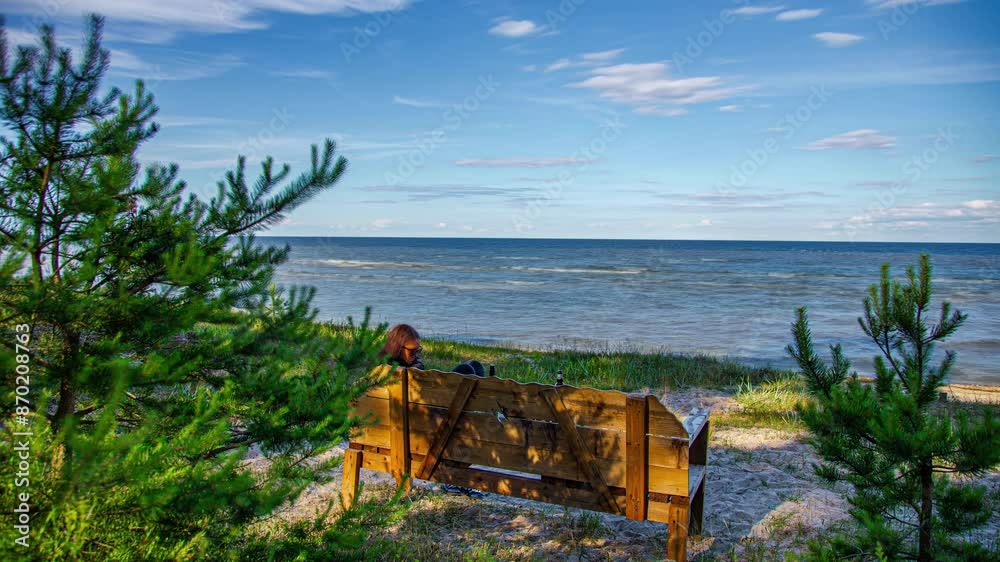 Young couple on a park bench overlooking the sea - time lapse Young couple on a park bench overlooking the sea - time lapse