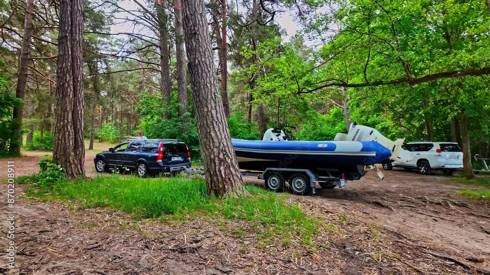 A peaceful camping experience in the forest with a boat launch ready for exciting lake adventures. A peaceful camping experience in the forest with a boat launch ready for exciting lake adventures.