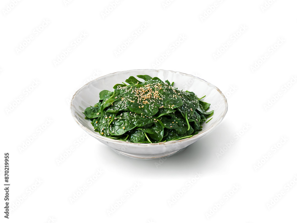Gomaae Blanched spinach dressed with a sesame sauce served in a glass dish isolated highlighting Gomaae Blanched spinach dressed with a sesame sauce served in a glass dish isolated highlighting