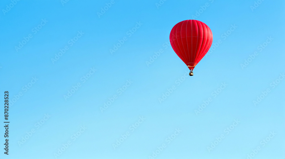 Minimalist, vibrant photo of a red hot air balloon floating against a pastel blue sky. Minimalist, vibrant photo of a red hot air balloon floating against a pastel blue sky.