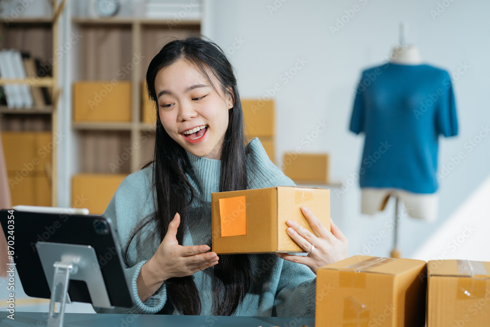 Asian vlogger woman influencer, SME retail store owner smile enjoy selling show live sale online screen smartphone work at home. Asian vlogger woman influencer, SME retail store owner smile enjoy selling show live sale online screen smartphone work at home.