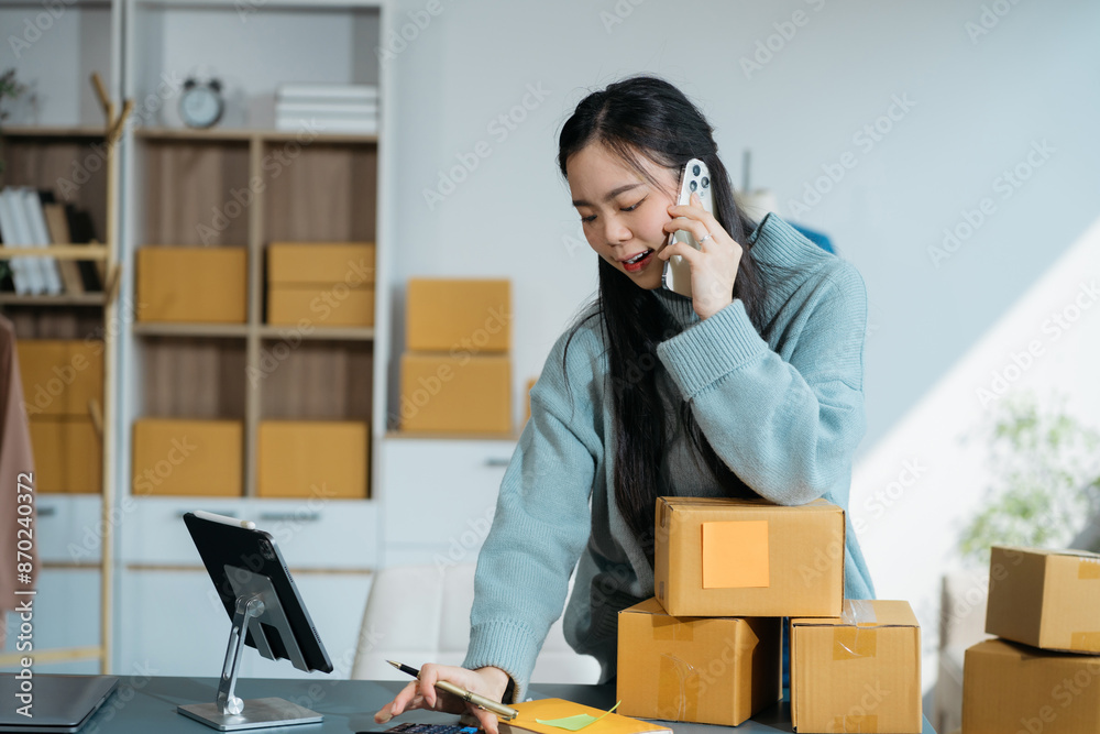 asian women using smartphone contacted a customer asking for a shipping address. asian women using smartphone contacted a customer asking for a shipping address.