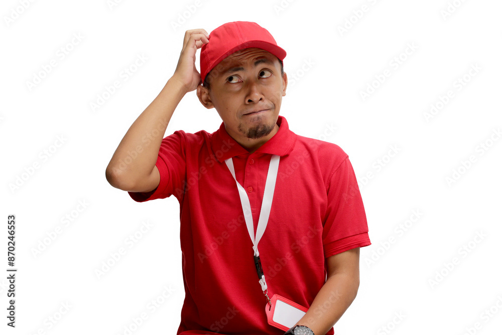 Confused Asian delivery man or courier scratching his head, thinking about something and having no clue. Isolated on a white background. Confused Asian delivery man or courier scratching his head, thinking about something and having no clue. Isolated on a white background.