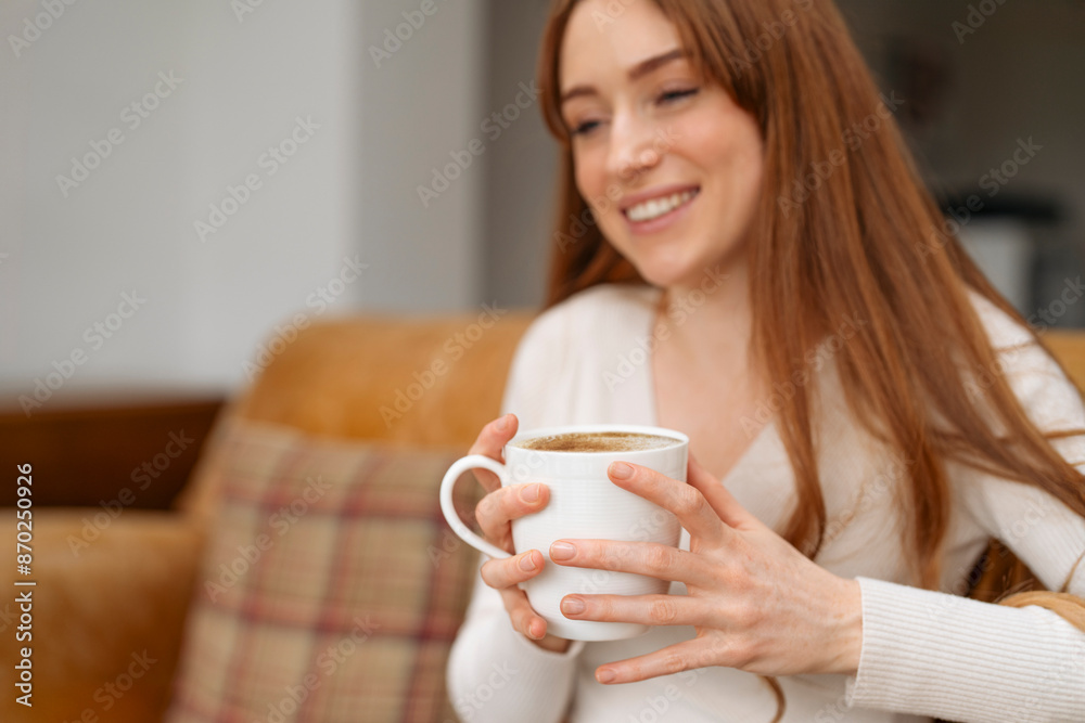 Woman Enjoying Cup of Coffee While Sitting on Couch Woman Enjoying Cup of Coffee While Sitting on Couch